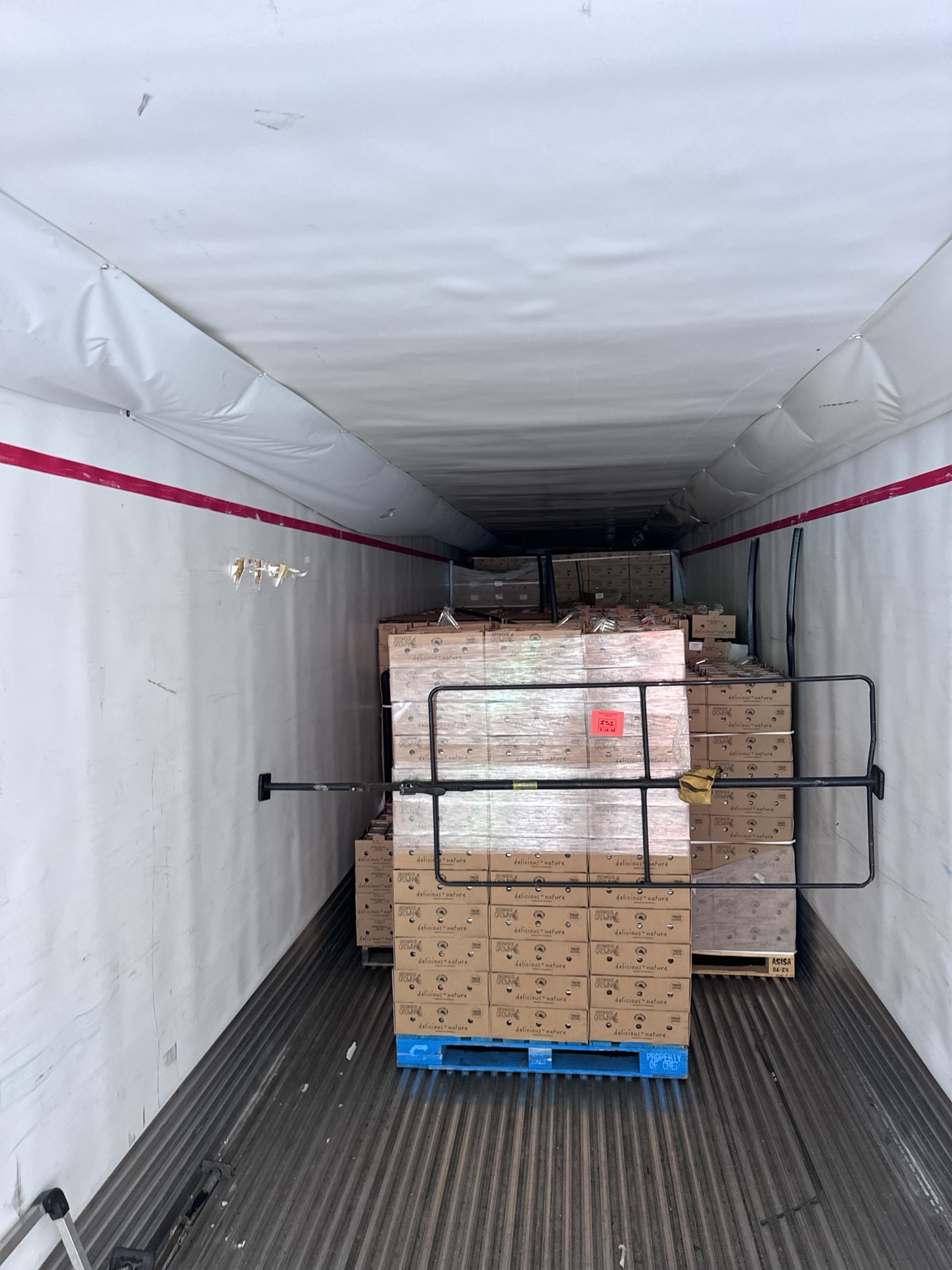 Loaded produce pallets inside refrigerated trailer