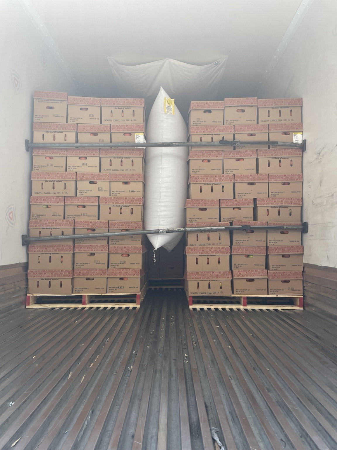 Palletized produce shipment with air bag protection