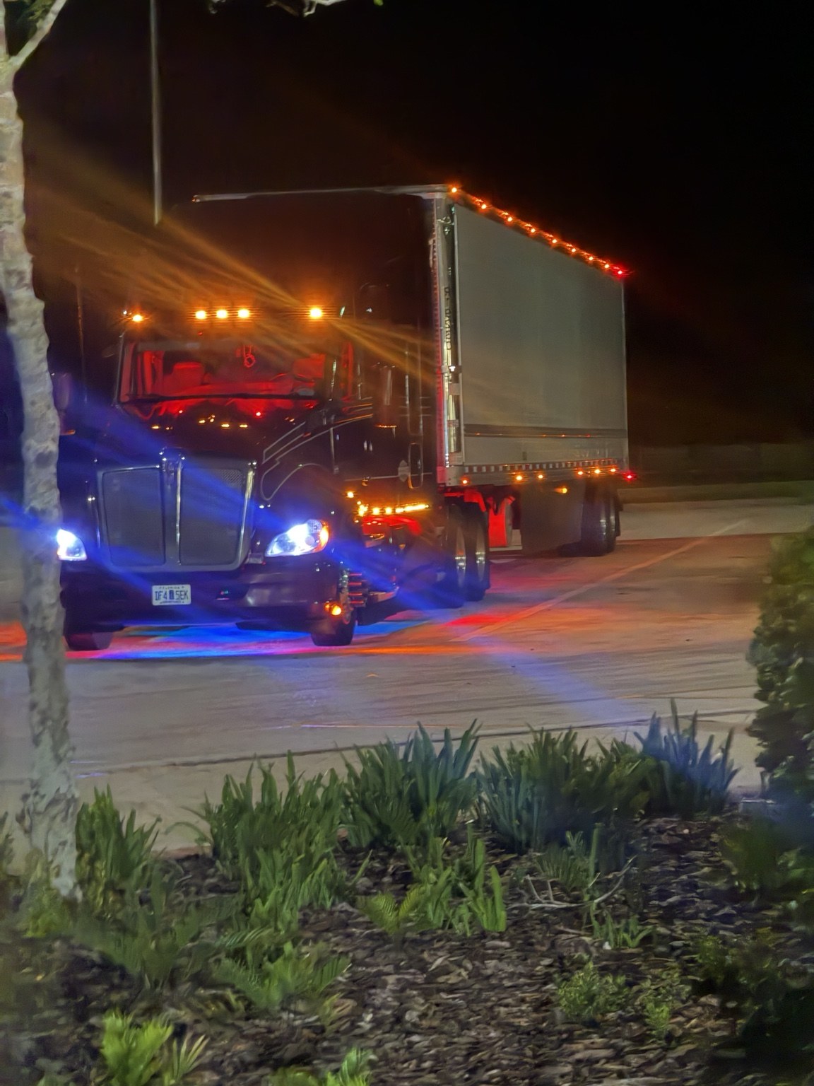 Constant Trucking tractor trailer at night
